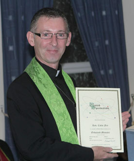 Reverend Colin Fry proudly displays his United Spiritualists ordination certificate.