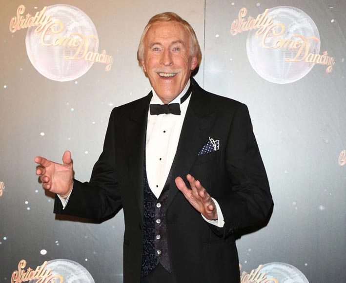 SIR BRUCE FORSYTH: “I do believe in spirits and the supernatural.” Here Sir Bruce is seen arriving for the “Strictly Come Dancing” 2012 launch at the BBC’s Television Centre in London. (Photo: Henry Harris/Featureflash Photo Agency) 