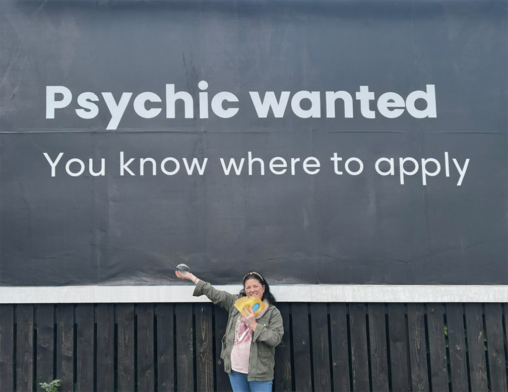 Louisa Earth Angel underneath Manchester psychic wanted billboard